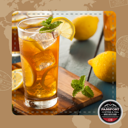 Fresh spearmint black tea with ice and lemon slices in a glass.