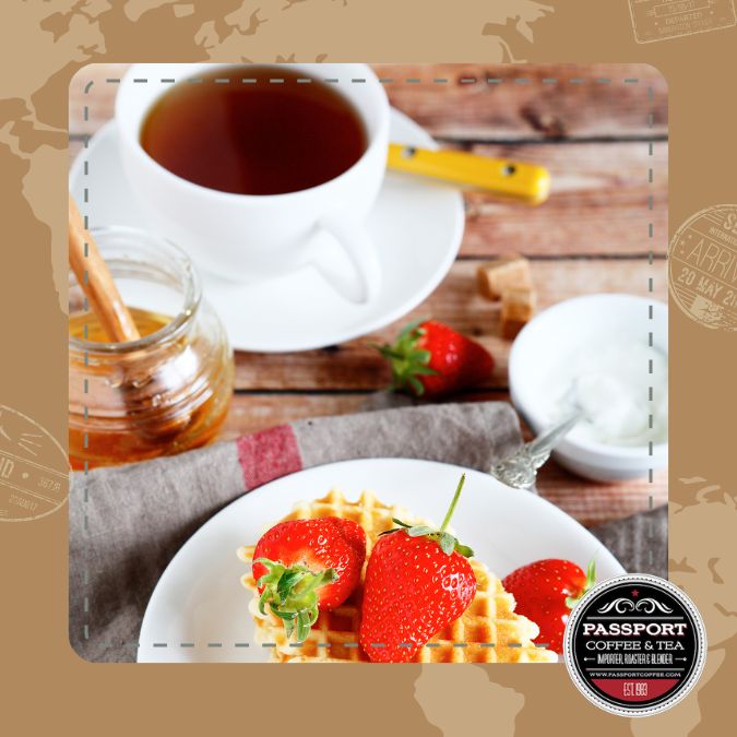 Wild Strawberry Black Tea with waffles and strawberries, by Passport Coffee & Tea.