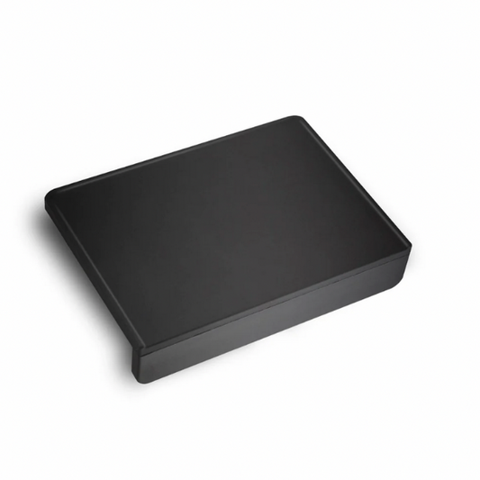 Black rubber tamp mat with indent for portafilter, 5.5 x 6.5 inches.